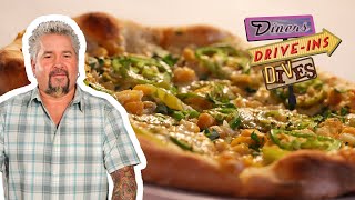 Guy Fieri Eats an Americano del Sur Pizza  Diners DriveIns and Dives  Food Network [upl. by Tereb747]